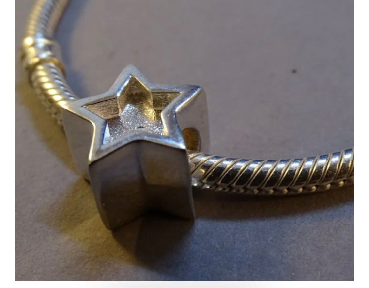 Silver star charm