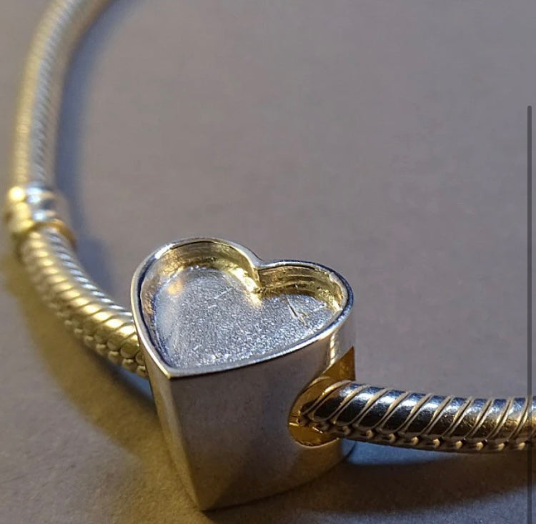 Silver heart charm